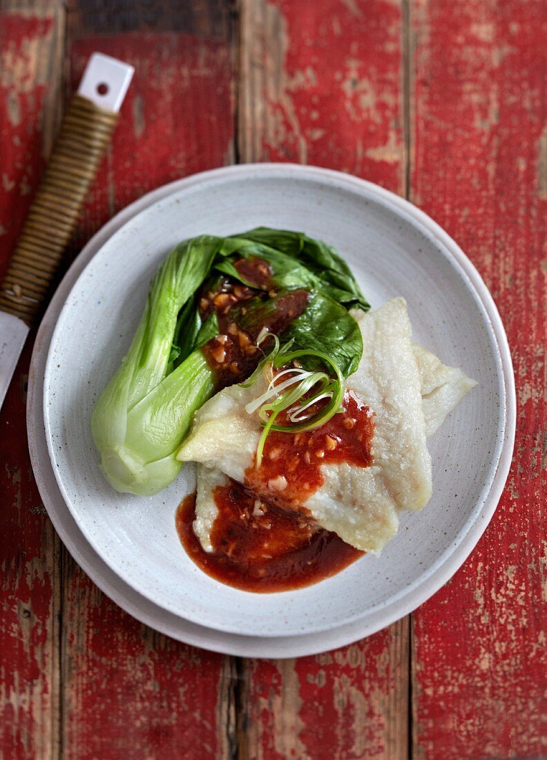Fish with a spicy chilli sauce and bok choy (China)