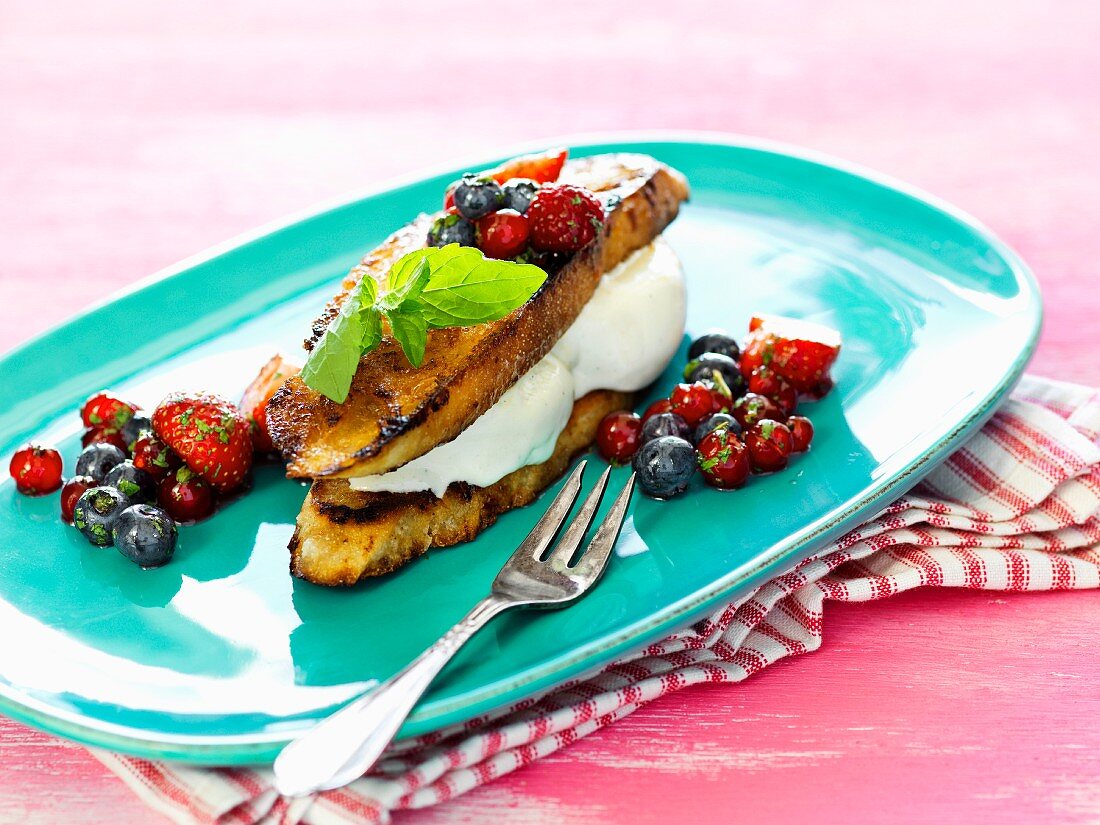 French toast with ice cream and a berry salad