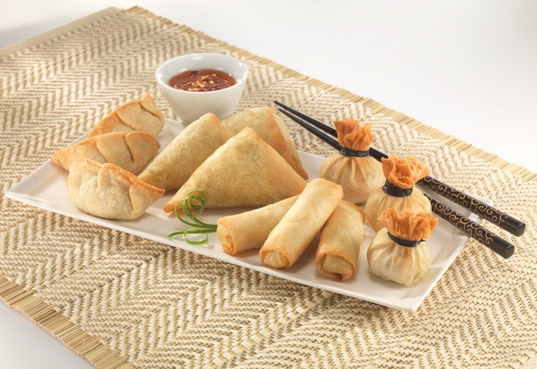 Various spring rolls with a chilli dip