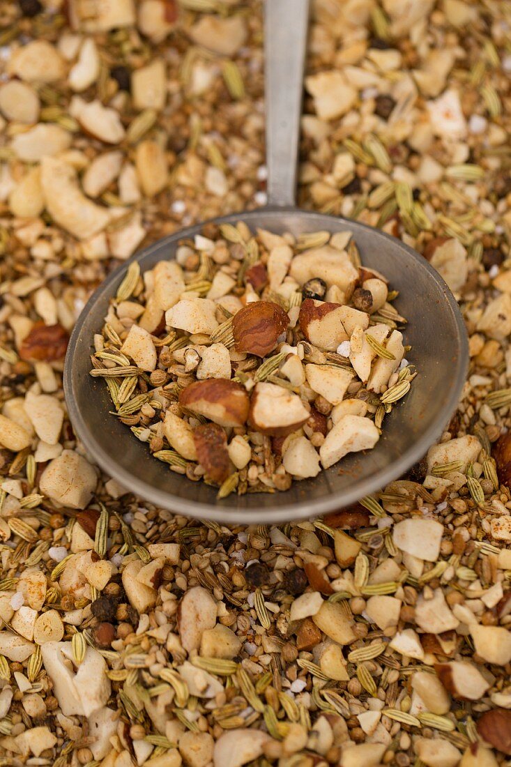 Dukkah spice mixture on a round spoon