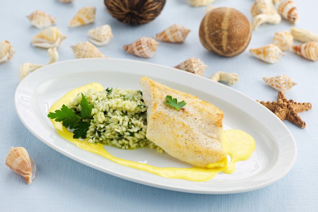 Sea bream with rocket risotto and saffron sauce