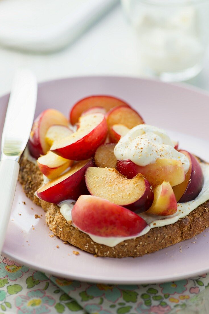 Grilled peaches and plums on toast