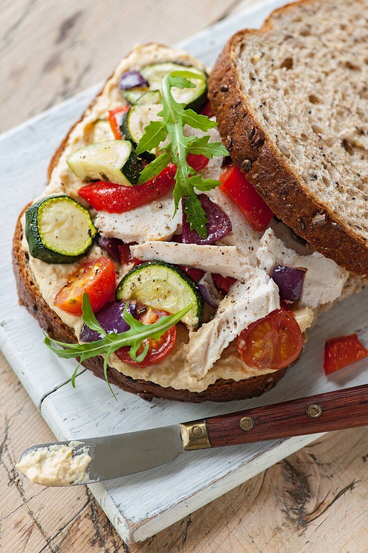 A roasted vegetable and chicken sandwich