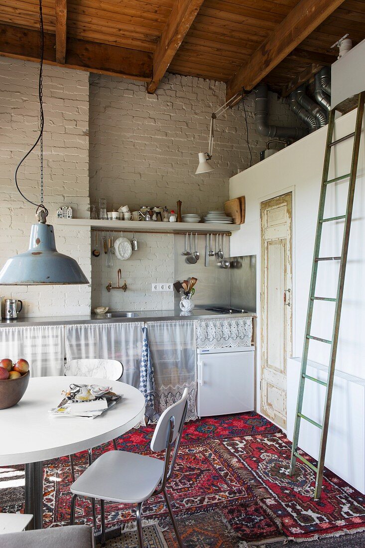 Dining area and kitchen in one-room apartment