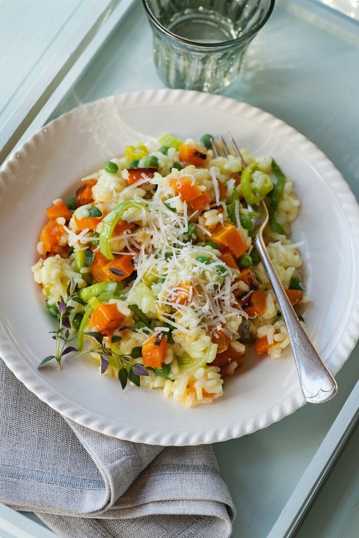 Butternut squash and pea risotto with grated cheese