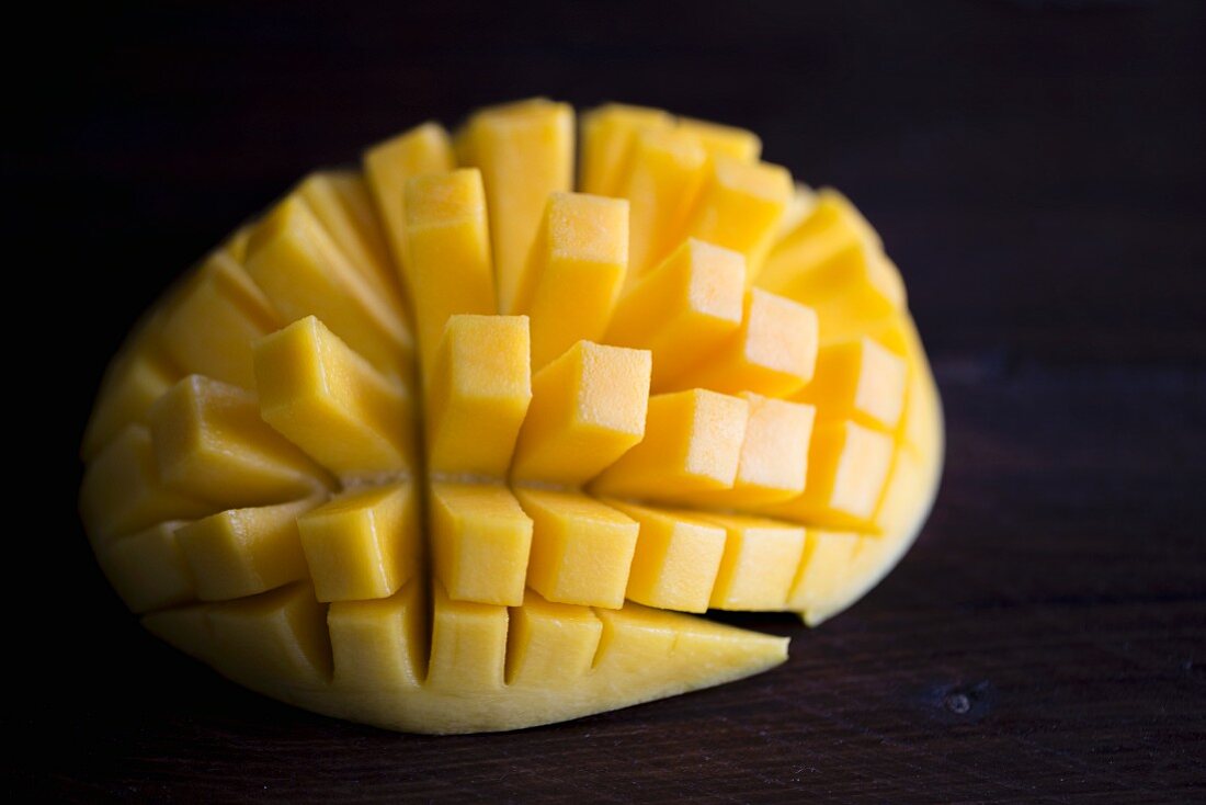 A halved, fanned-out mango