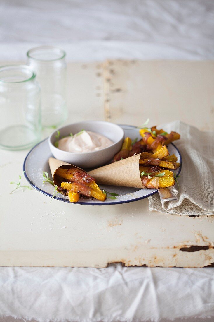 Pumpkin chips in bacon with a pepper dip