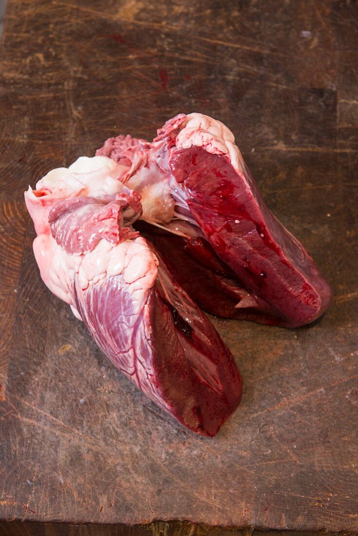 A beef heart on a wooden board