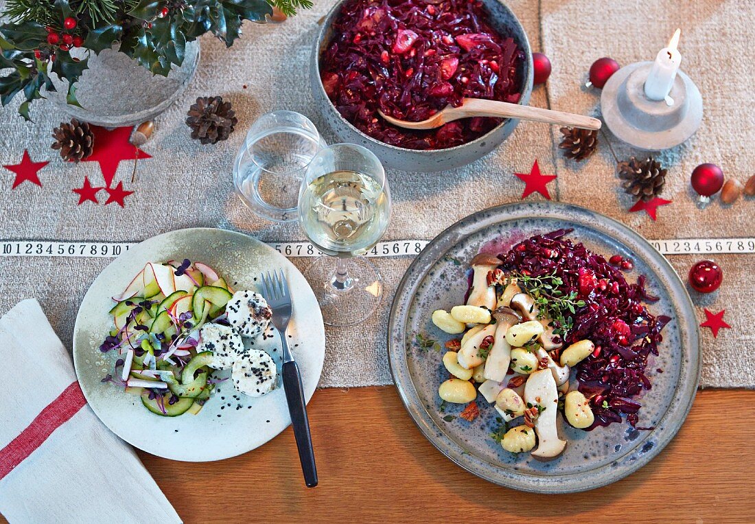 King trumpet mushrooms with pomegranate red cabbage, and thyme gnocchi served with an apple and cucumber salad with goat's cheese