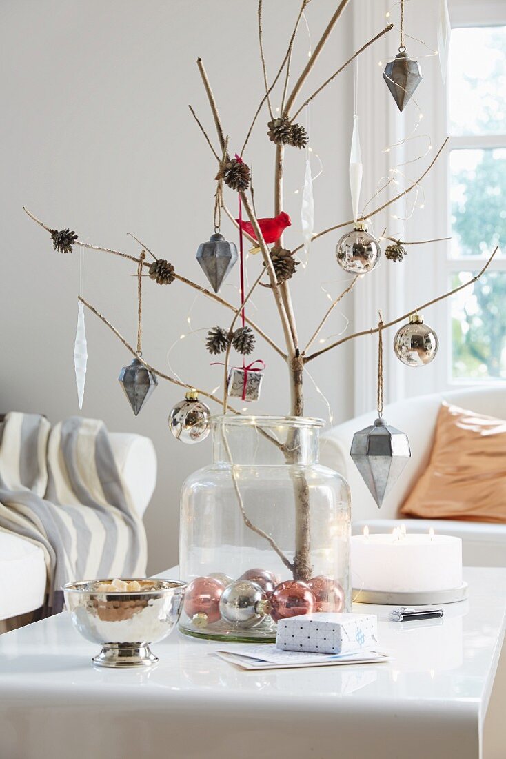 A beach pine with decorated with pine cones and baubles for Christmas