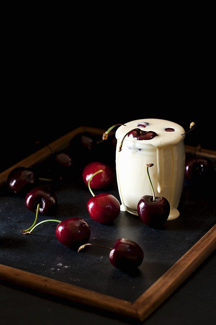 Cherries in a glass of cream