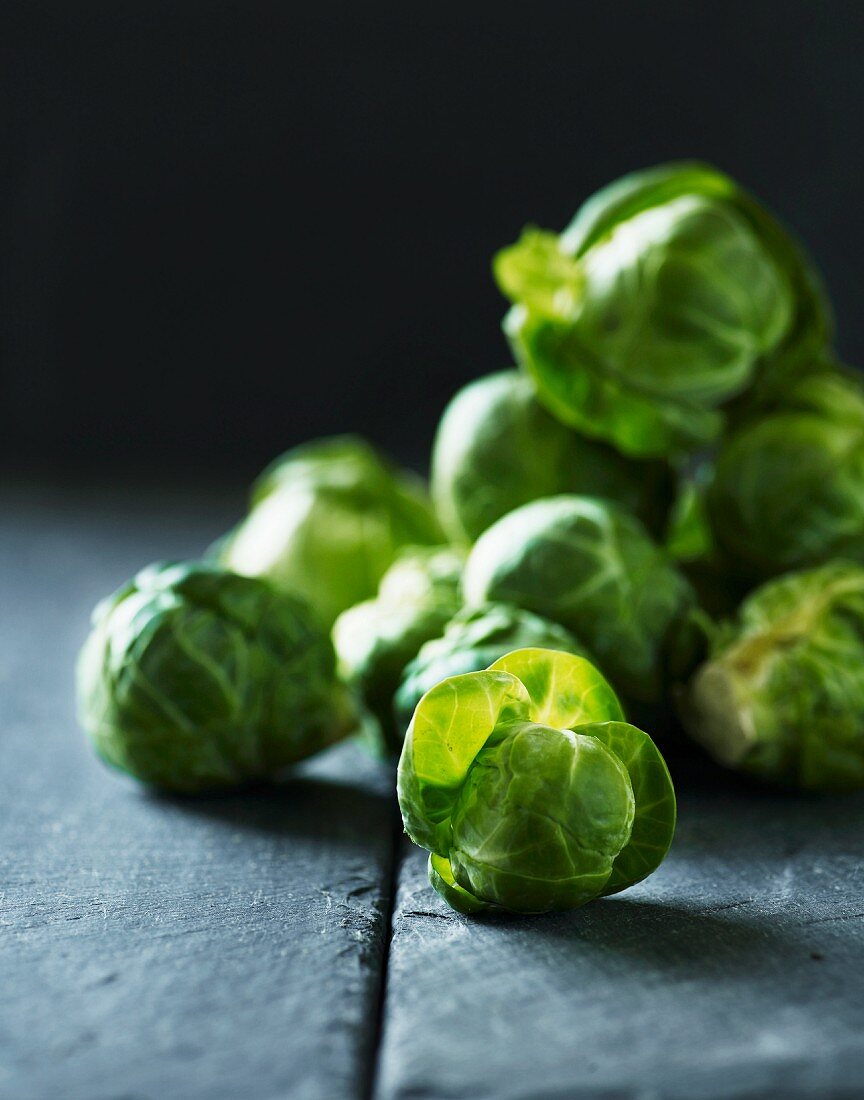 Brussels sprouts on a grey surface