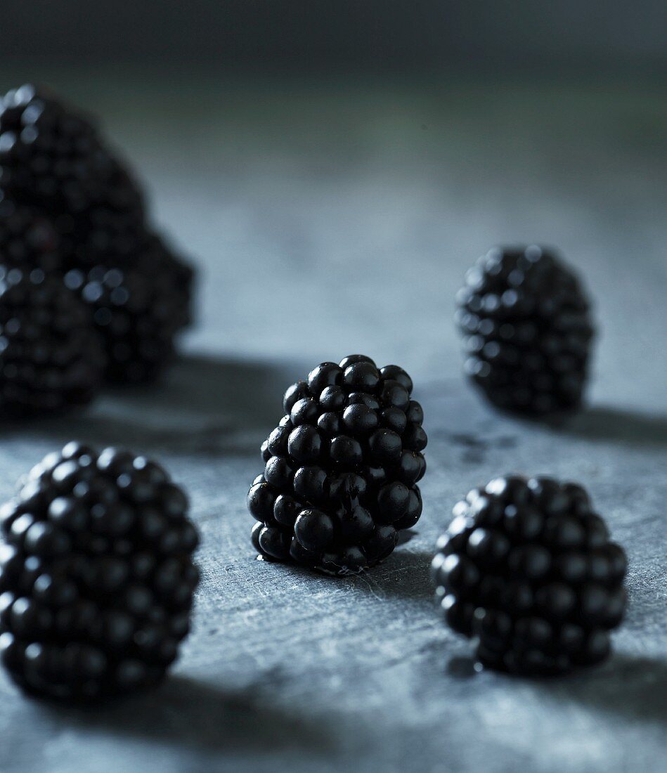Blackberries on a grey surface