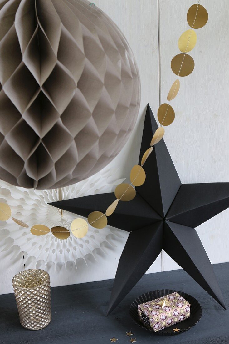 Paper Christmas decorations with origami star and garland