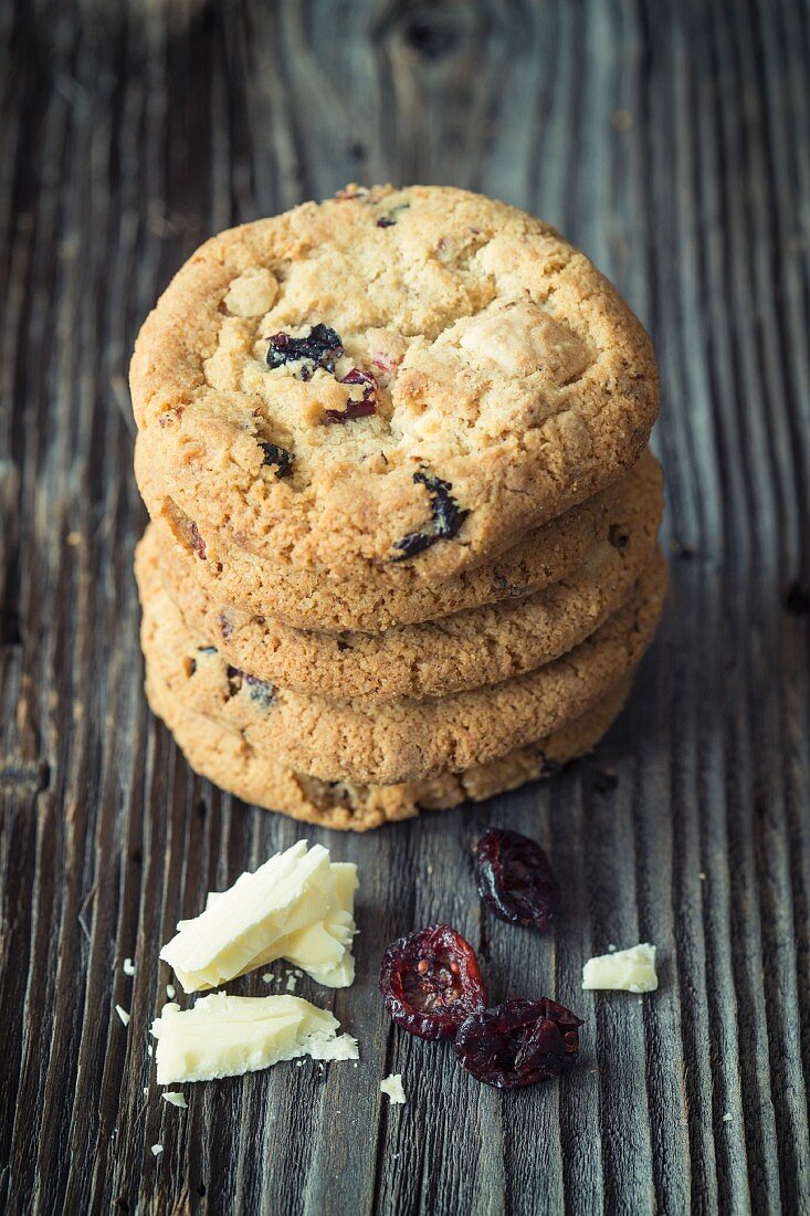 A stack of cookies with white chocolate and dried craberries