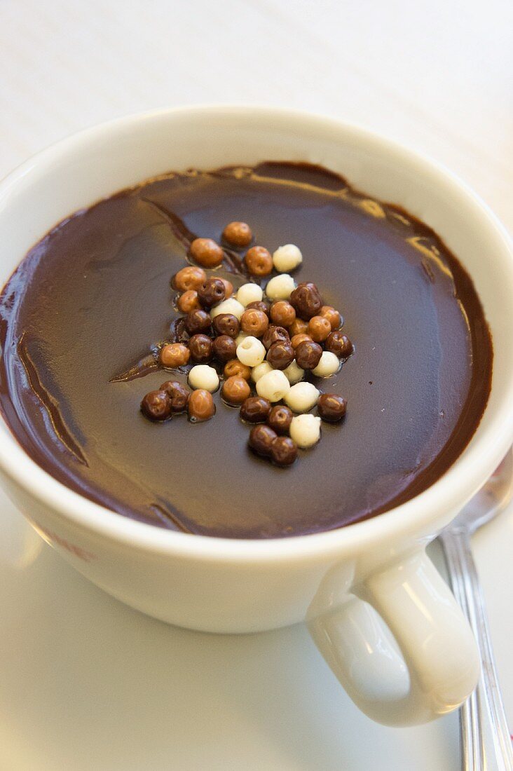 Italian hot chocolate sprinkled with crispy chocolate pearls