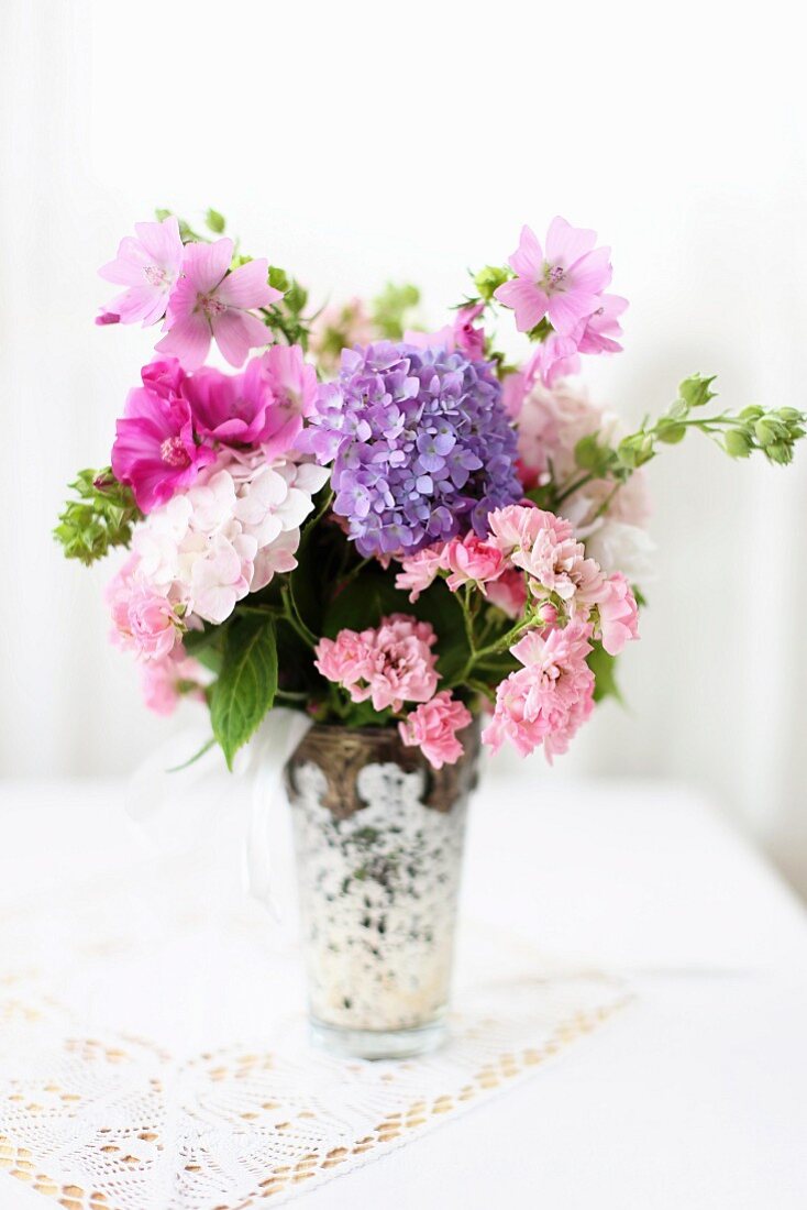 Bouquet of hydrangeas, wood anemones and mallows