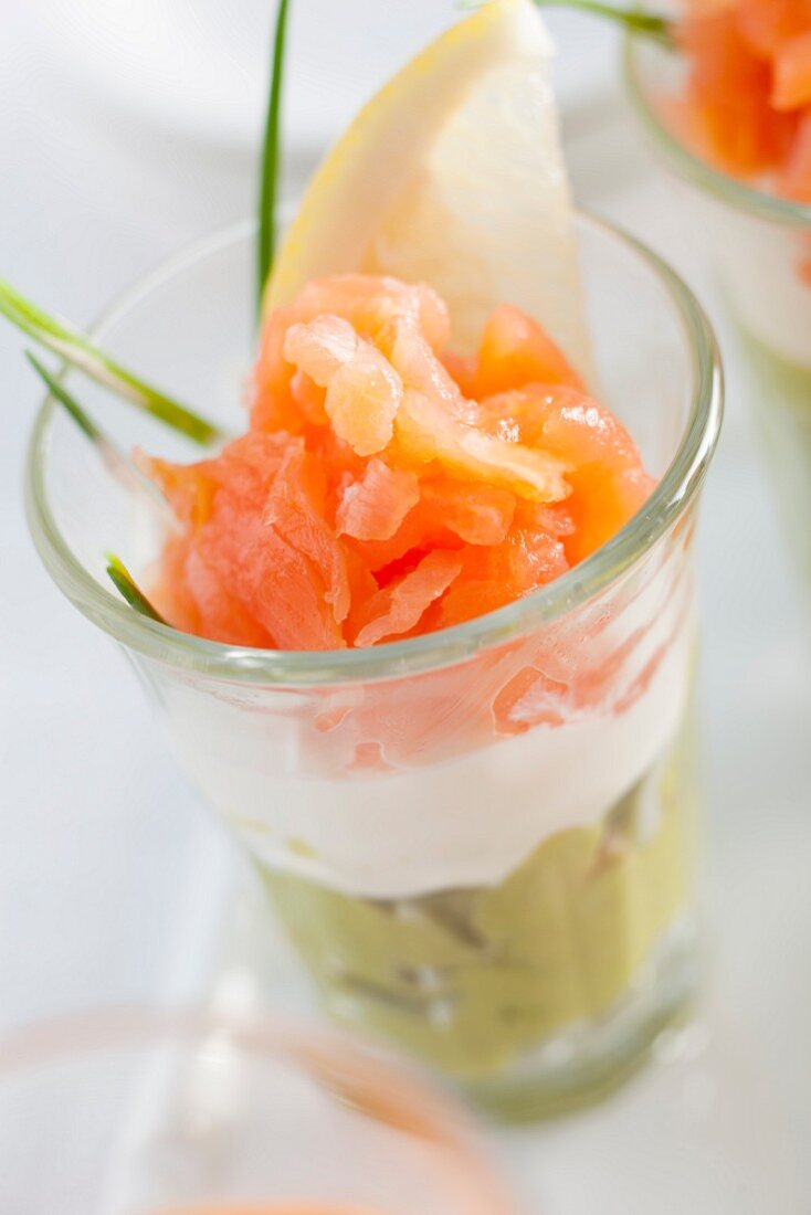 Salmon with avocado and crème fraîche in a glass