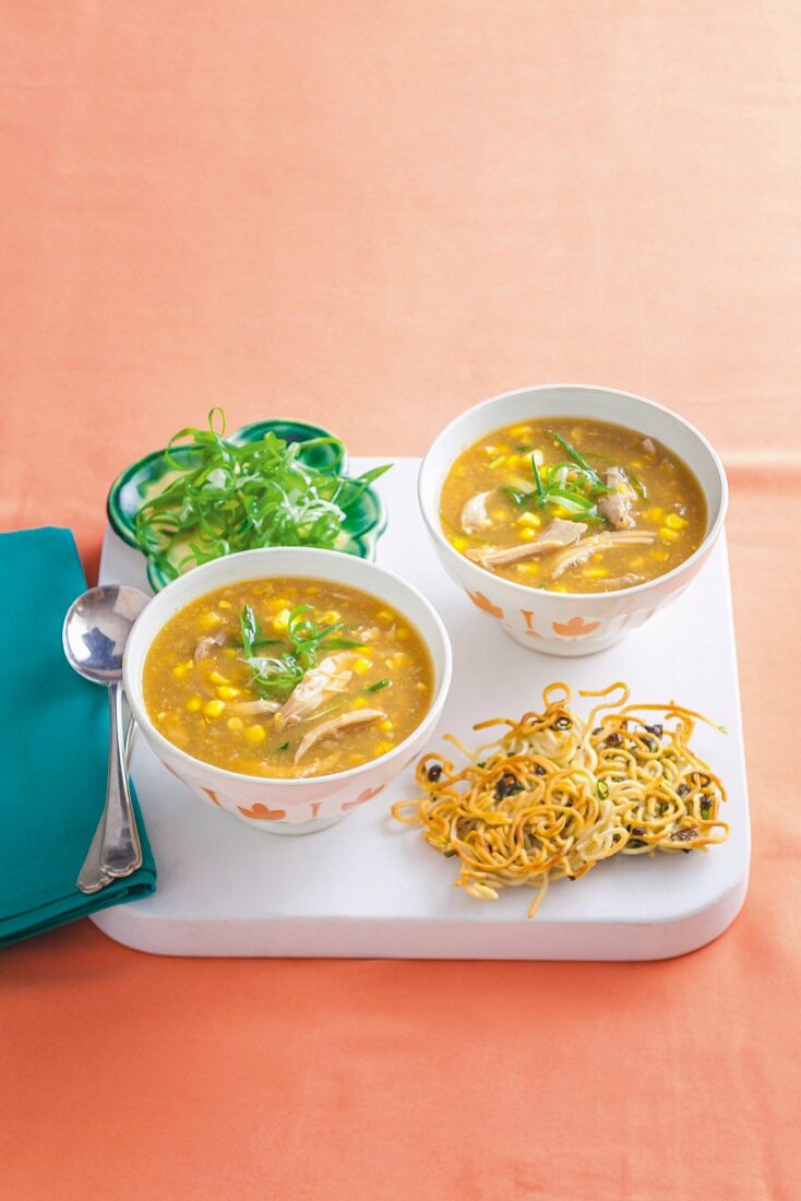 Chicken and corn soup with noodle cakes