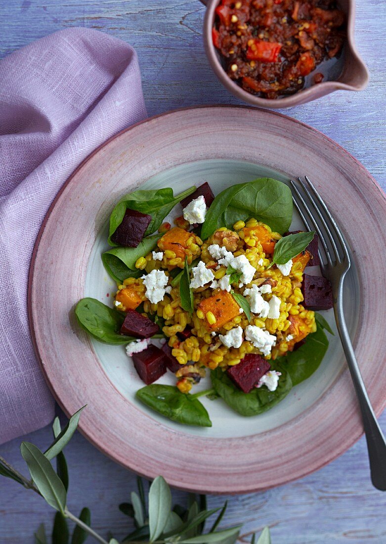 Spelt risotto with pumpkin, beetroot, spinach and goat's cheese