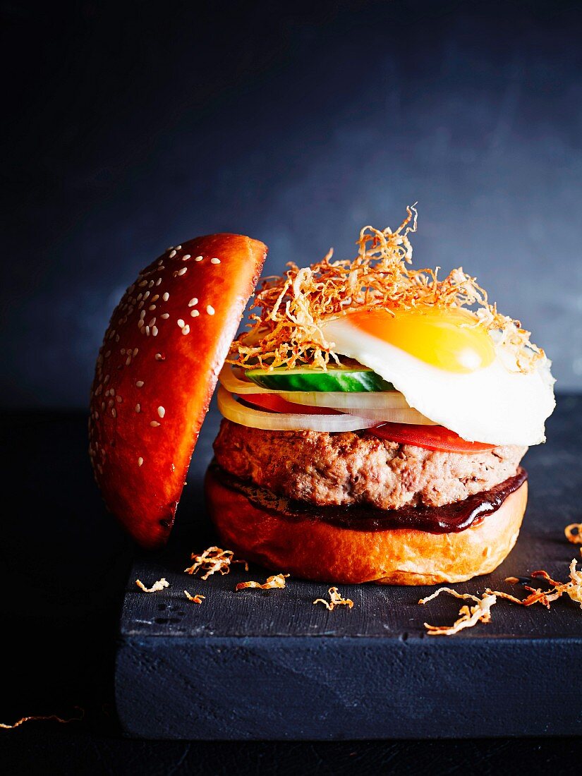 A classic burger with a fried egg, close-up