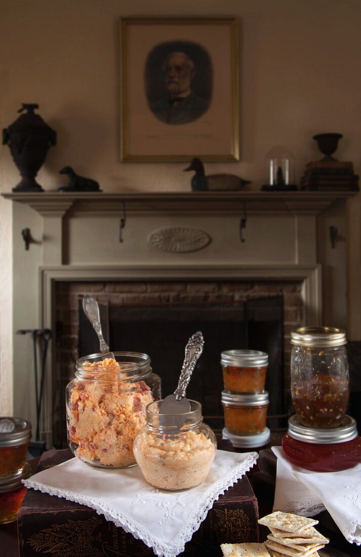 A festive buffet with cream cheese, crackers and spreads in an elegant living room