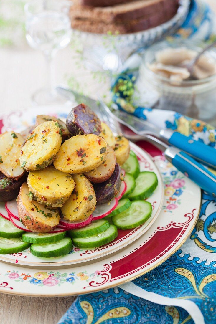 Warm potato salad with cucumber, radishes and a mustard dressing