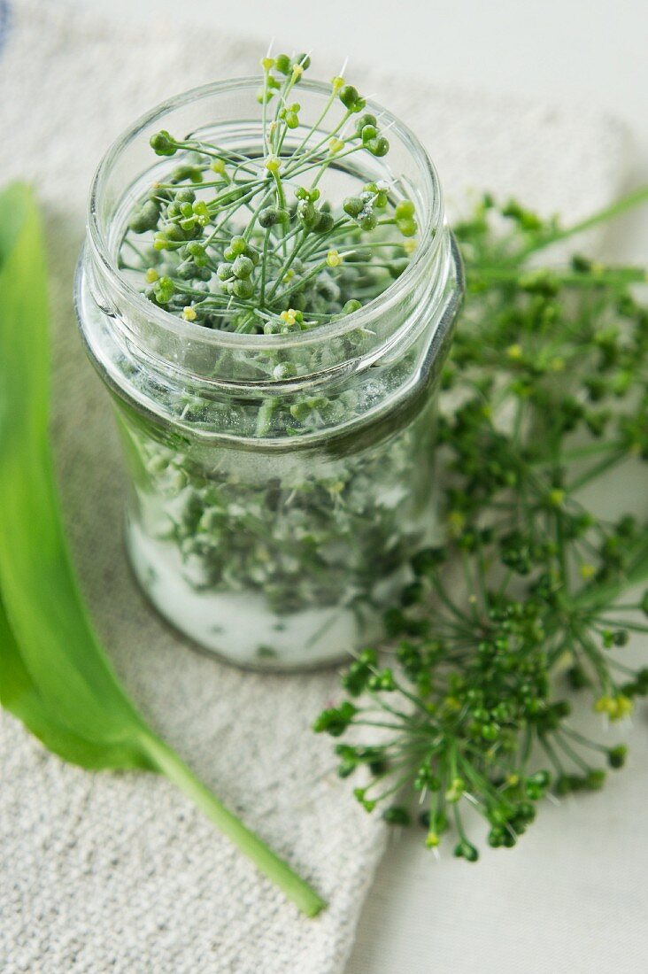 A jar of wild garlic seed pods and salt