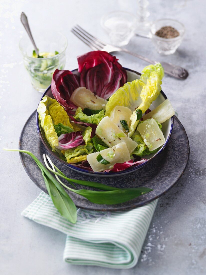 Marinated Handkäse (handmade sour milk cheese) on a mixed leaf salad