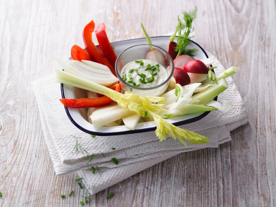 Colourful vegetables sticks with a chive dip
