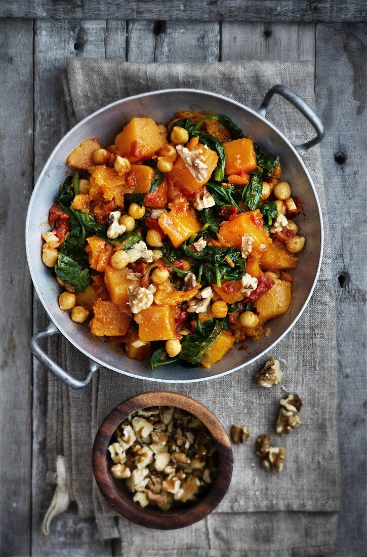A pumpkin and spinach medley with chickpeas and walnuts