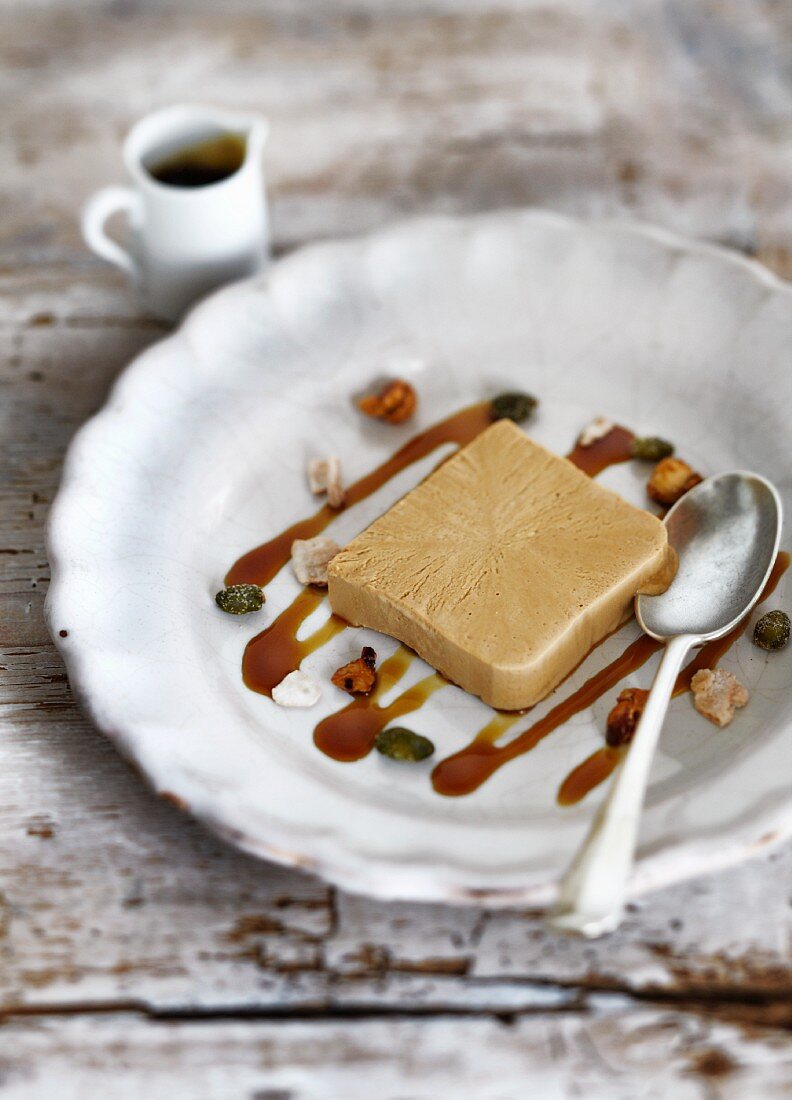 A slice of coffee parfait with caramel sauce