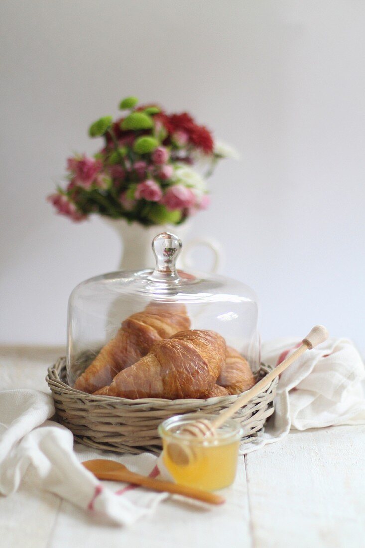 Fresh croissants and honey