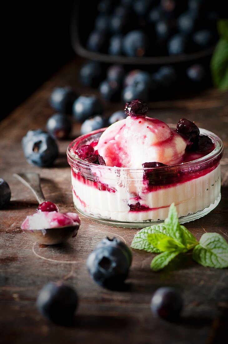A mini cheesecake with blueberry compote