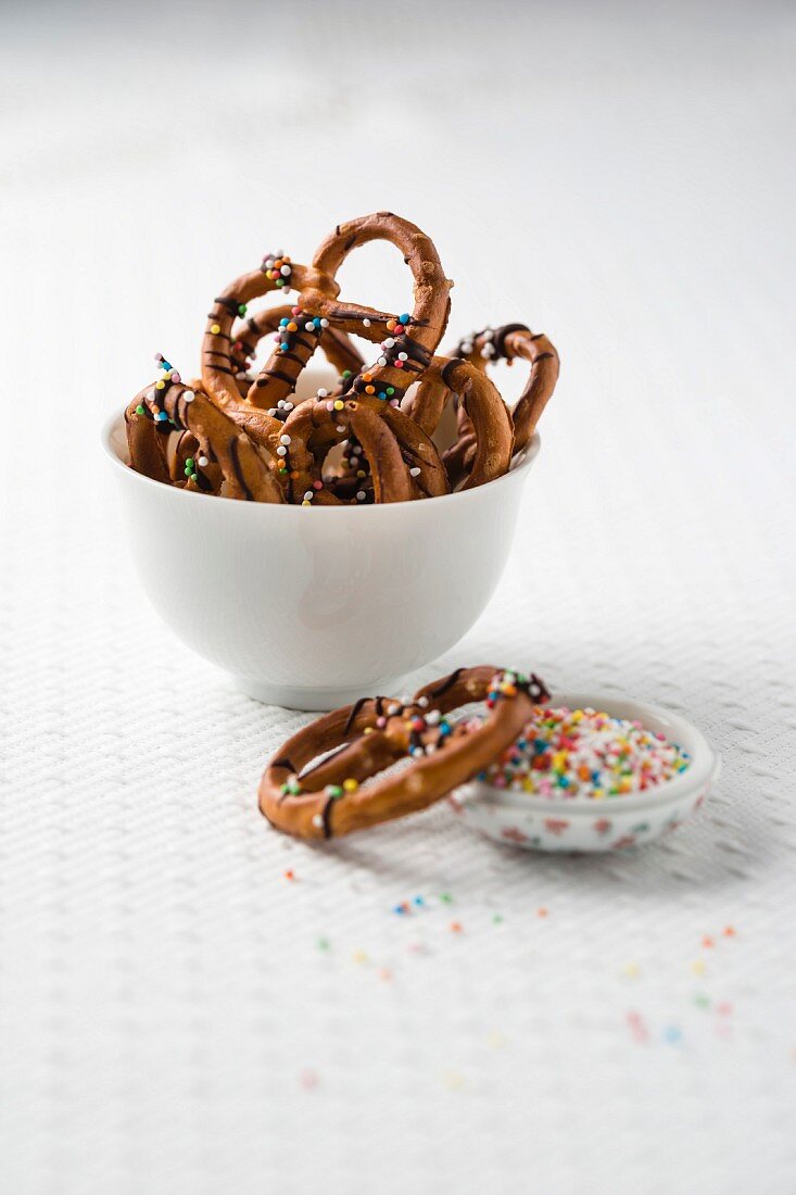 Salted pretzels with chocolate and sugar sprinkles