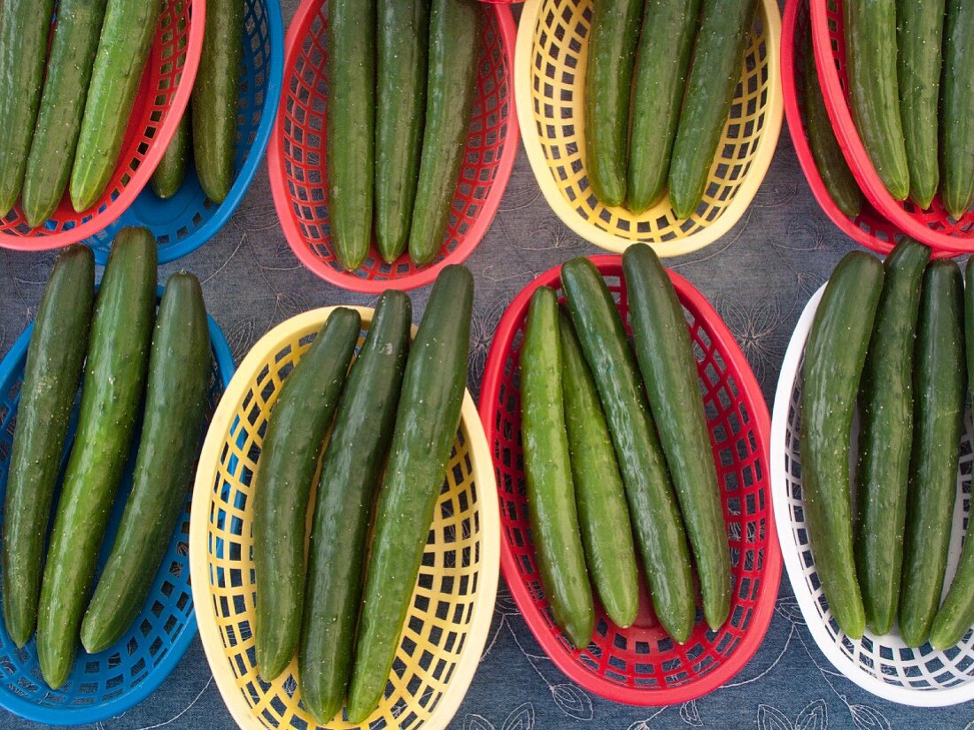 Cucumbers in plastic baskets