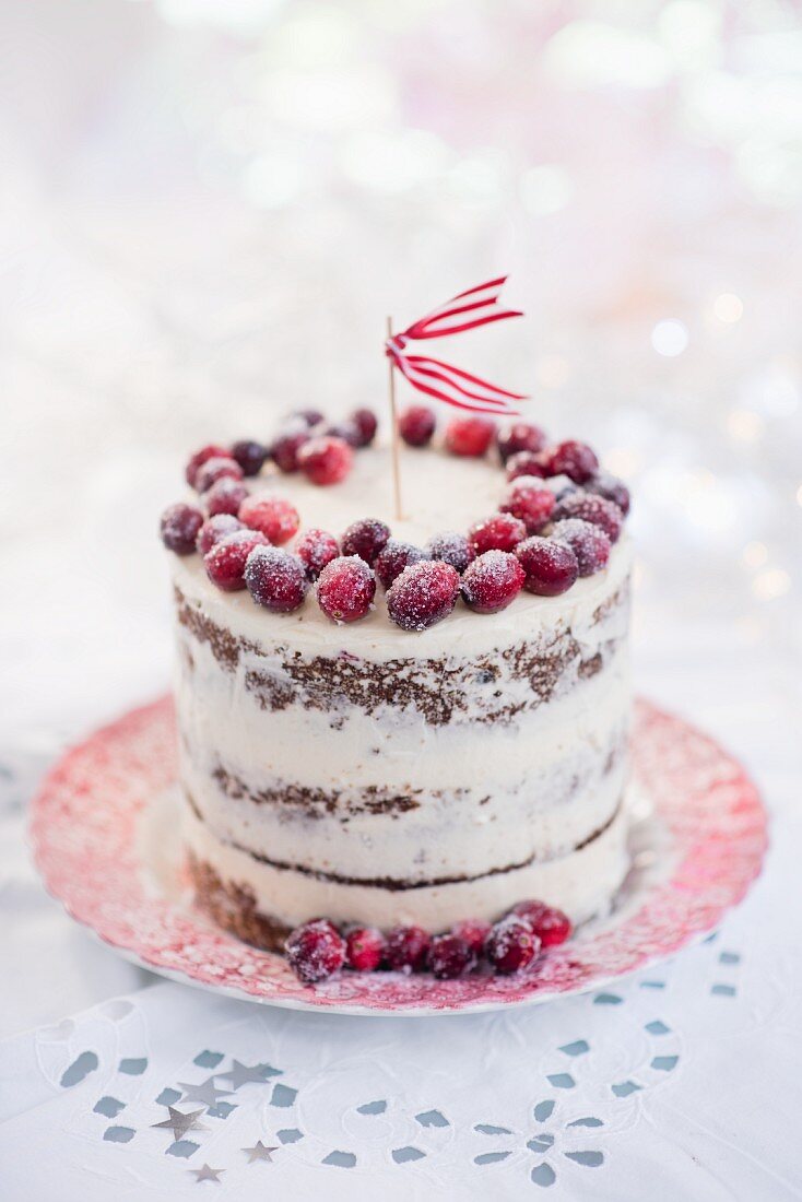 A Christmas cake with cranberries, oranges and walnuts