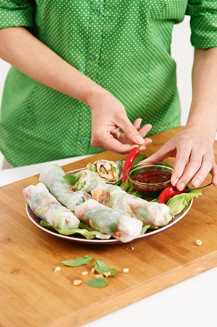 Stuffed rice paper rolls served with a chilli dip