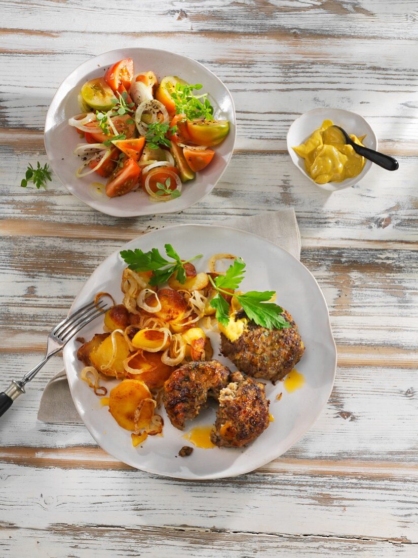 Meatballs with fried potatoes and mustard