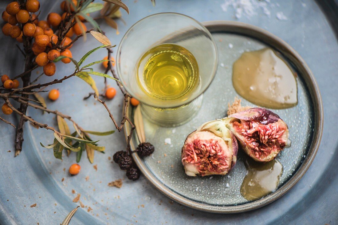 Figs with sea buckthorn honey and a glass of liqueur