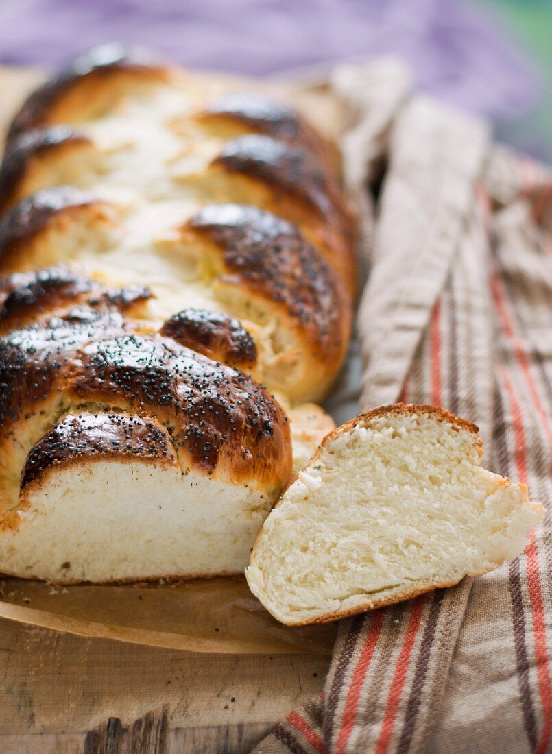 A plaited loaf sprinkled with icing sugar