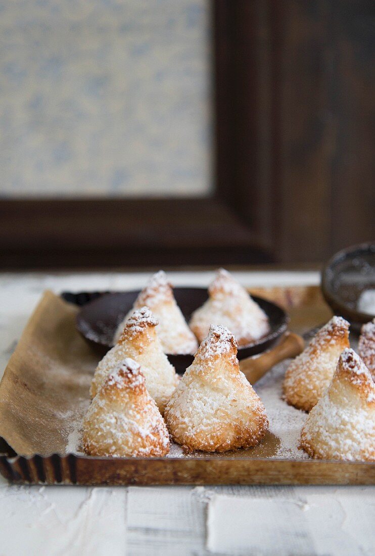 Coconut macaroons on a wooden tray