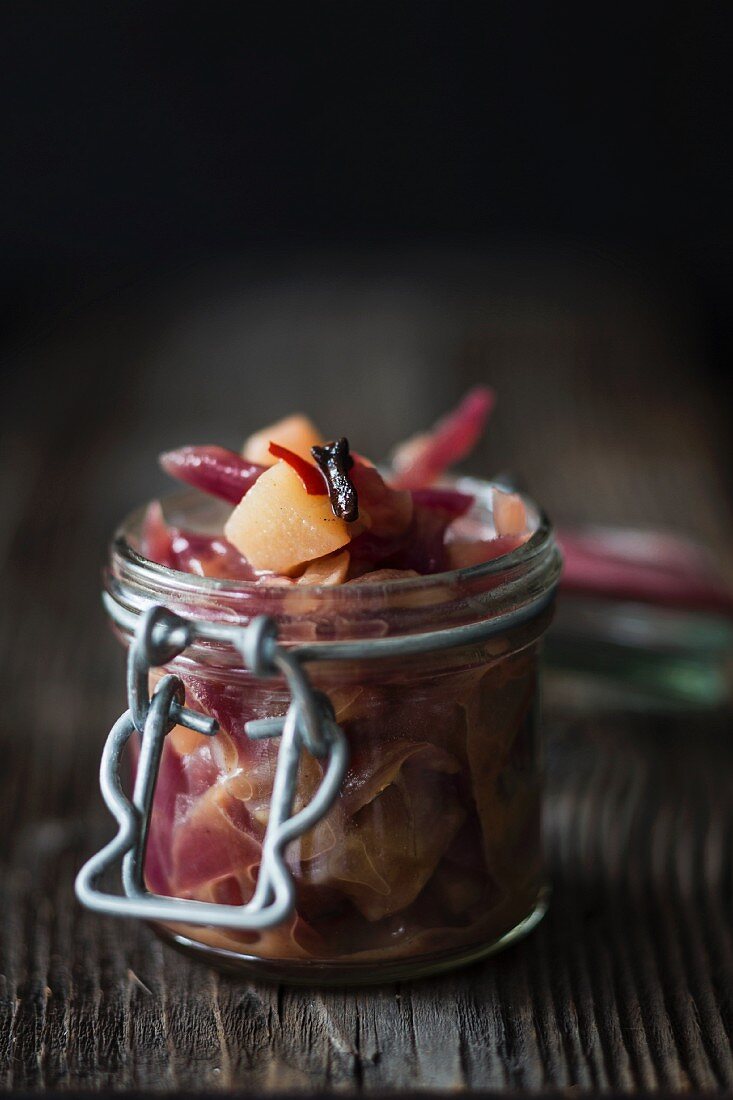 A jar of pear and red onion chutney