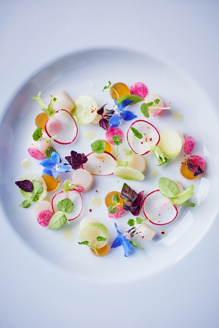 Scallops with radishes and edible flowers