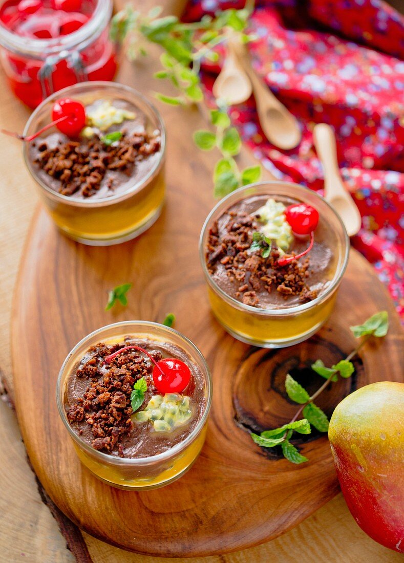 A dessert with mango and cocktail cherries