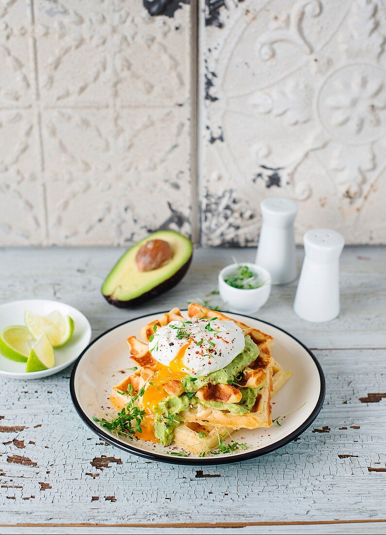 Parmesan waffles with avocado cream and a poached egg