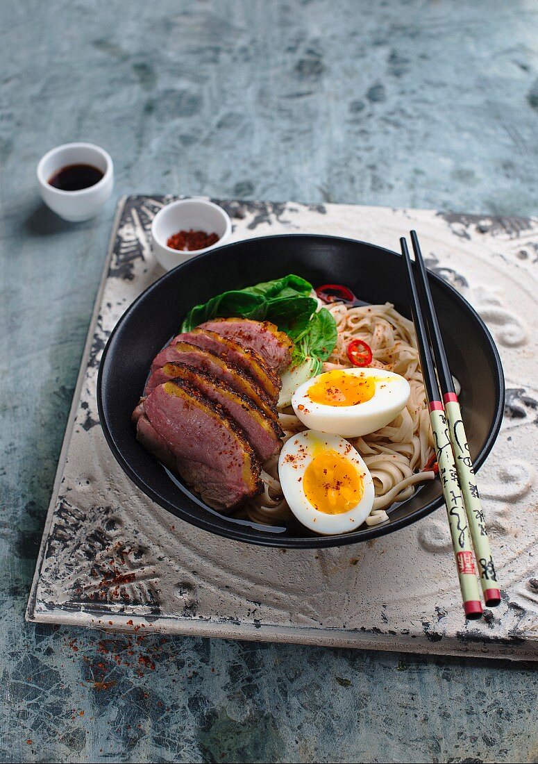 Noodles with bok choy, duck and a hard-boiled egg