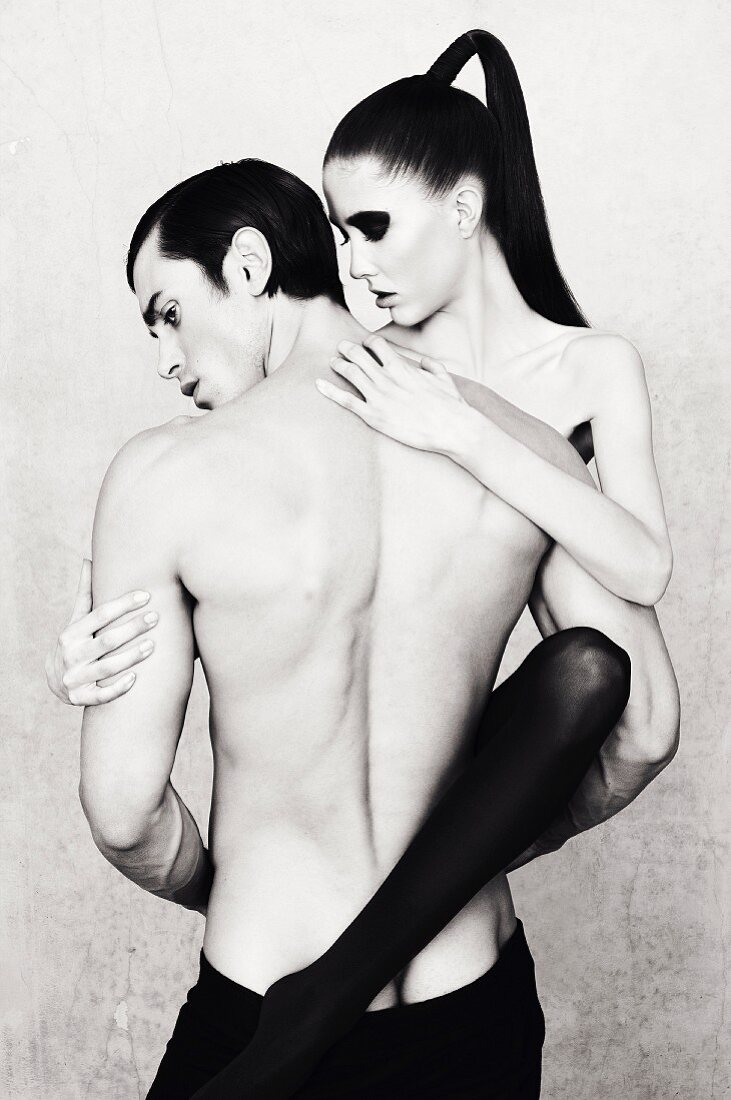 A young topless couple embracing (black-and-white shot)