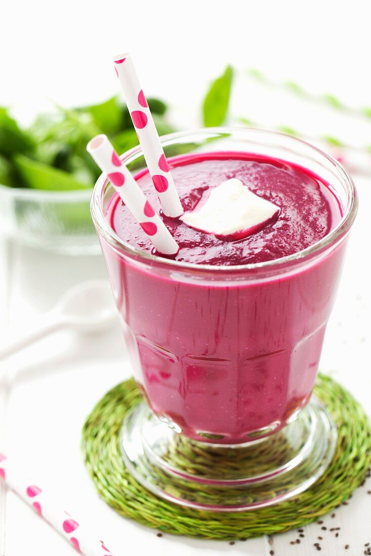 A beetroot, apple and spinach smoothie in a glass