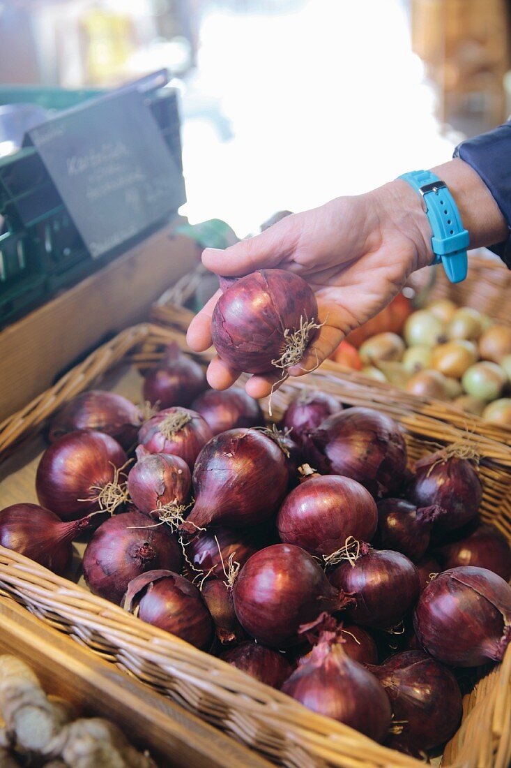 Organic red onions in a shop